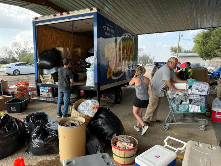 People loading a truck with supplies during 104.3 WZYP's Tornado relief effort