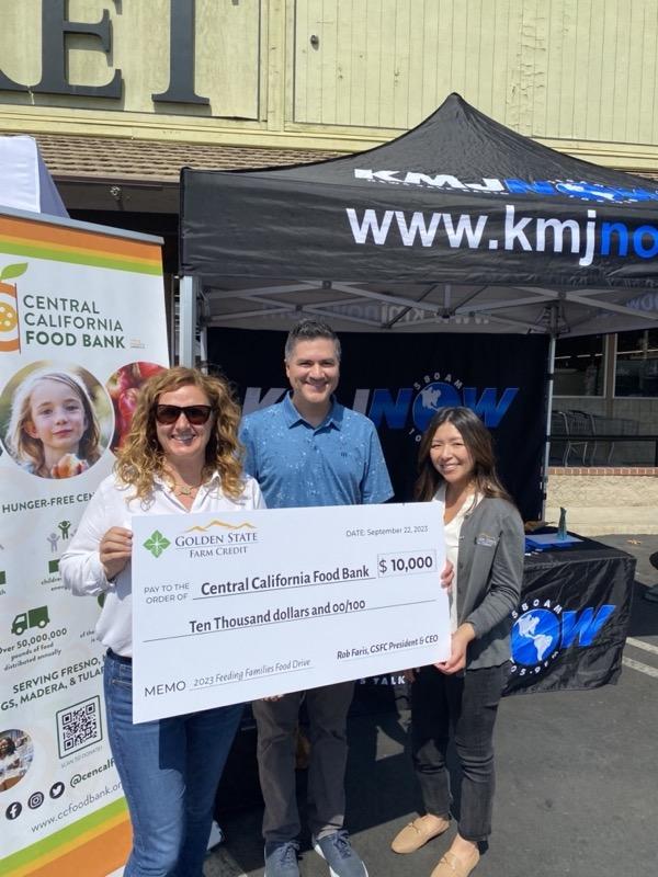 Left, White shirt and sunglasses, is Kym Dildine, CEO, Central California Food Bank. Others pictured are unidentified.