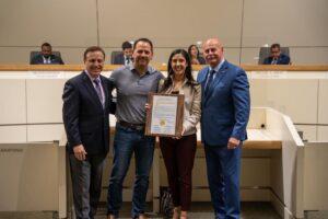 KMJ's Christina Musson (holding plaque) and husband Ralph Rendon are flanked by Fresno City Councilman Garry Bredefeld (Left), and Fresno Mayor Jerry Dyer (Right).